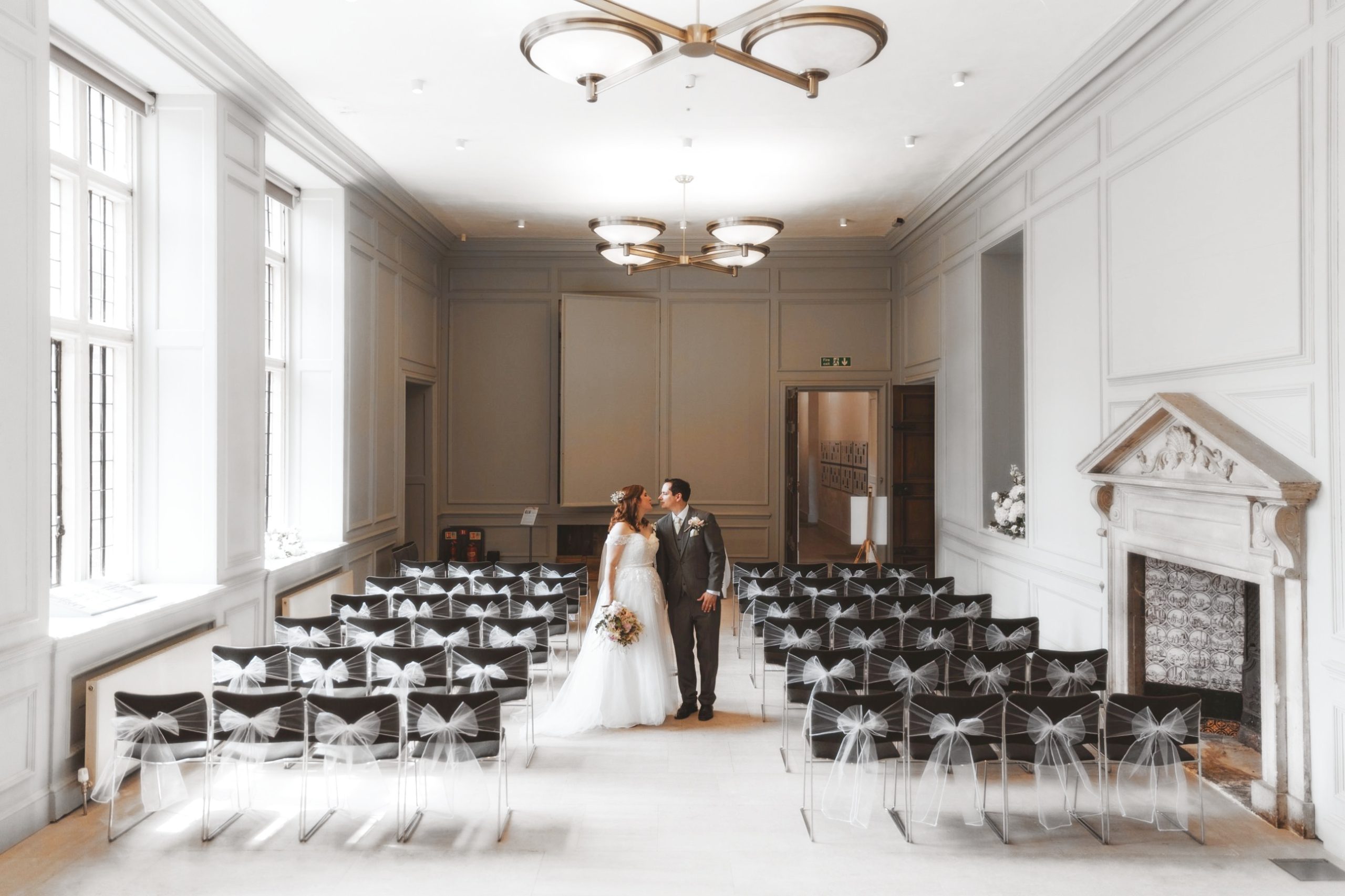 A bride and groom in the Ceremony Room at Shaw House, Newbury